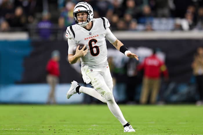 Jake Browning runs with the ball in one hand